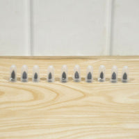 Set of black tire repair nails for vehicles