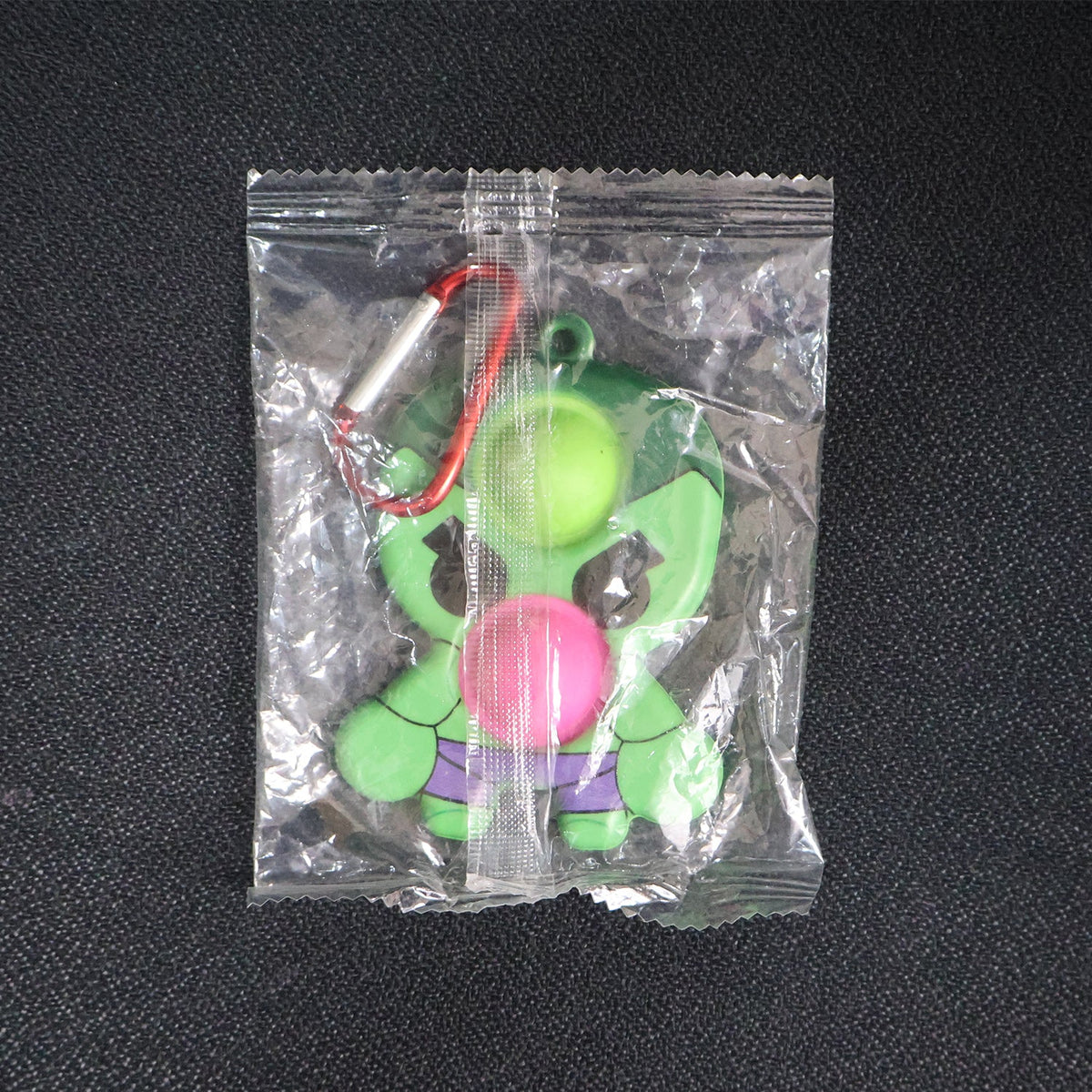 Silicone Pop It fidget toy with portable keychain clip for on-the-go use