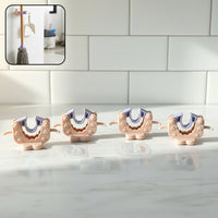 Close-up view of wall mounted broom and mop holder clip