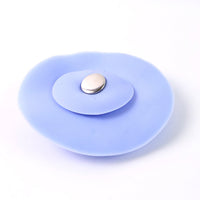 Flexible blue silicone sink stopper and strainer showing easy-to-clean design