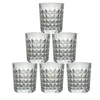 A stack of elegant diamond-cut glass tumblers, illustrating their compact storage and design.