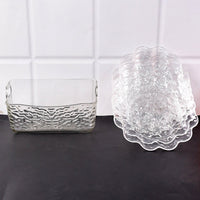 Elegant plastic bowls with textured finish arranged on serving tray