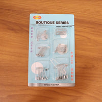 Organized set of rust-resistant metal safety pins in various sizes