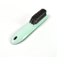 The versatile household scrubber shown with water, ready for deep cleaning.