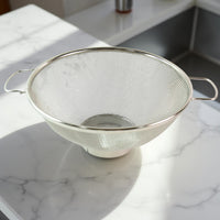 Dual ergonomic welded handles on stainless steel colander for easy grip