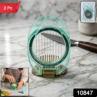 Person using manual vegetable slicer to cut carrots easily