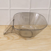 View of the strainer basket draining water in the sink