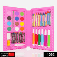 Open Kids Art Kit displaying crayons, watercolor cakes, sketch pens, and accessories.