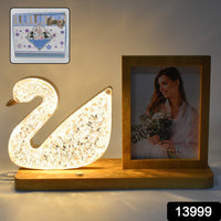 Close-up of duck crystal LED lamp showcasing photo frame element
