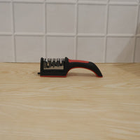 Close-up showing the four sharpening stages of the knife sharpener