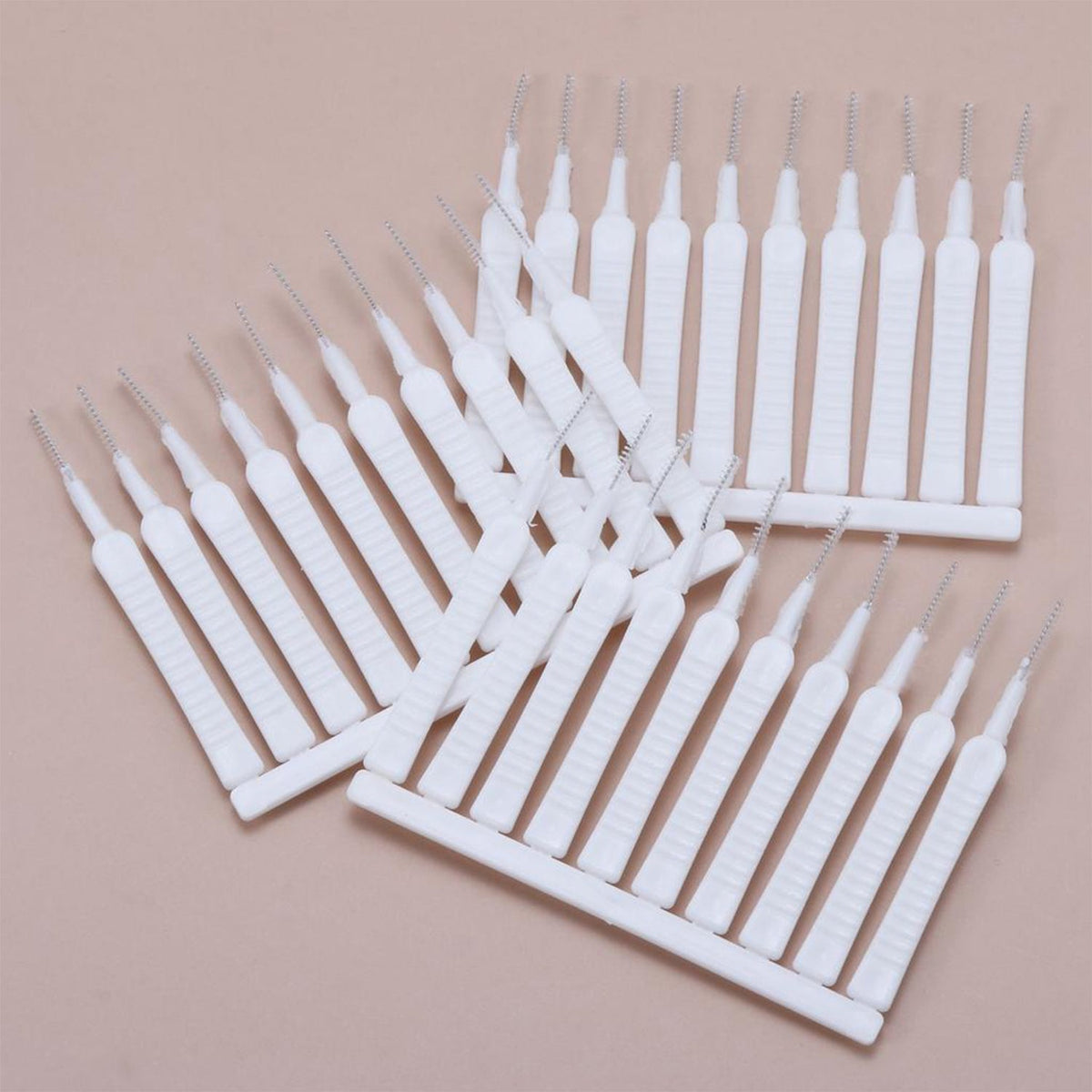 The shower head cleaning brush set displayed with a focus on its ergonomic handle.