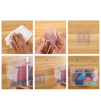 Two waterproof adhesive wall hooks neatly organizing keys and a small bag near an entrance.