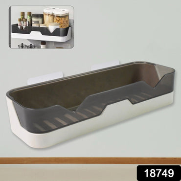 Close-up of the plastic adhesive shower caddy, highlighting its spacious design.