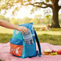 Side profile of the ergonomic Whale Spray Sippy Cup, designed for easy toddler grip.