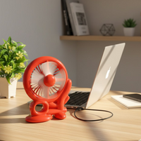 Close-up of the three white blades on the efficient red Mini Cooling USB Fan.