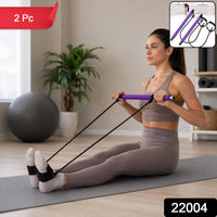Person demonstrating yoga stretches using the resistance band exercise bar.