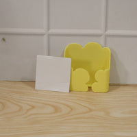 Product packaging highlighting key features of the wall mount holder.