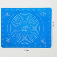 Durable silicone mat being folded to demonstrate its flexibility and ease of storage.