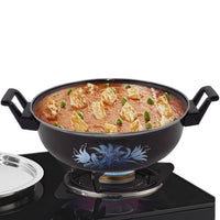 Traditional iron tava pan used for tempering spices