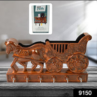 Close-up view of the intricate Rath design on the plastic key rack, showing traditional details.