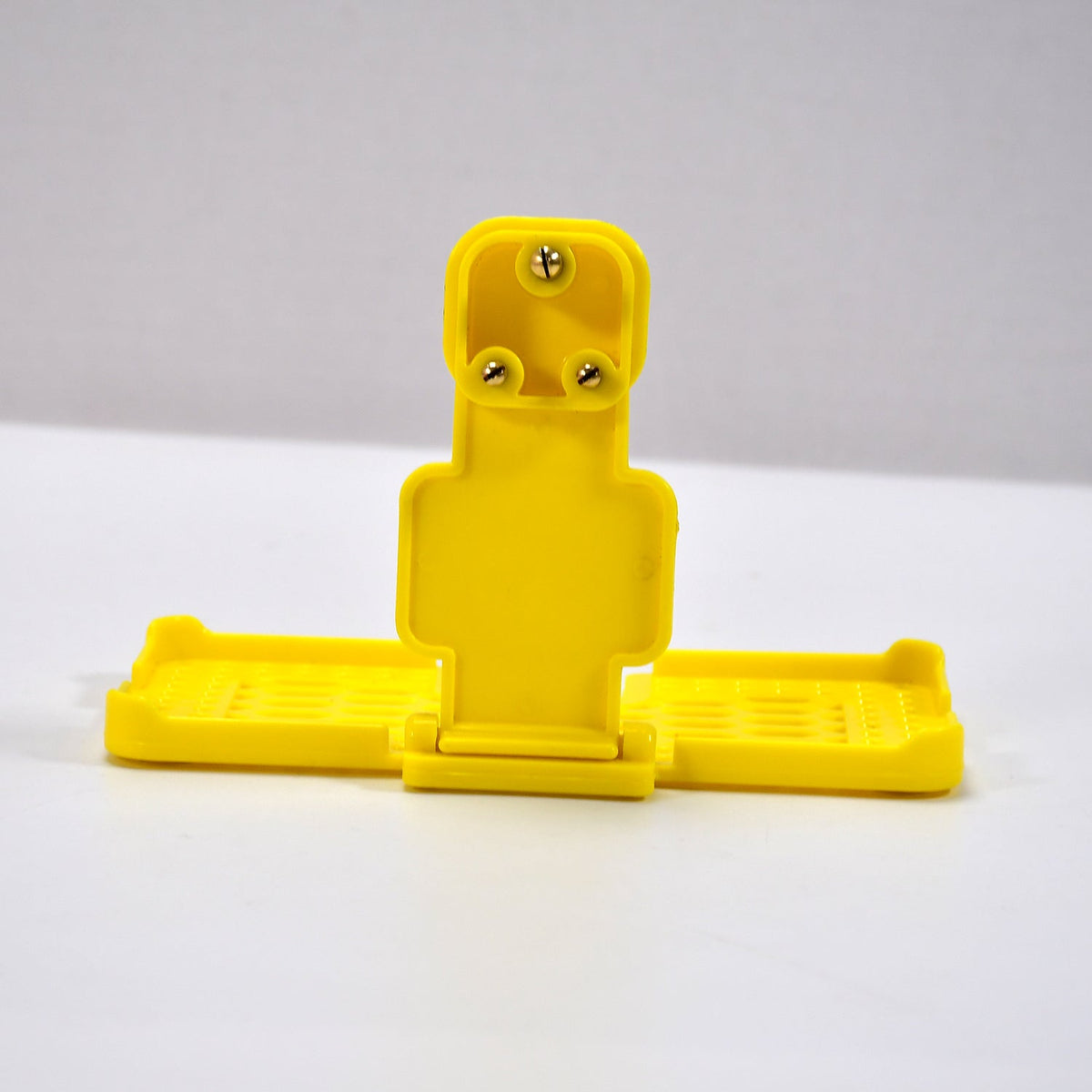 Back view of the PHOBIA yellow mobile charging wall holder, ready for installation.