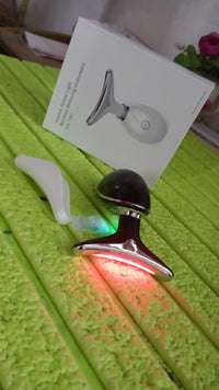 Woman applying the Neck Face Massager to her jawline for a lifting effect.