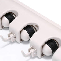 Detailed view of the durable construction of the GlimmerHome mop and broom holder.