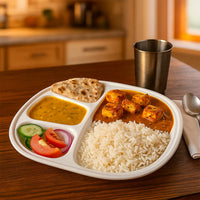 Plain view of plastic dinner plate with 4 compartments