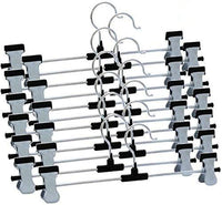 Close-up of adjustable anti-rust clips on a stainless steel hanger.
