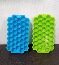 Colorful silicone ice cube tray with honeycomb design for easy release.