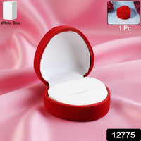 Open velvet ring box showing smooth white cushioned interior holding ring securely
