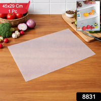 Refrigerator shelf lined with transparent plastic refrigerator mat and organised food items
