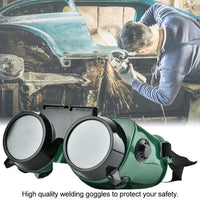 Worker wearing comfortable dark green welding goggles over eyeglasses for industrial use.