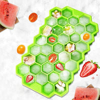 Close-up of small honeycomb ice cubes in a flexible silicone tray.