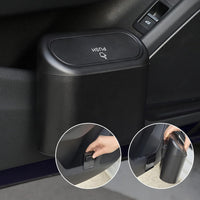 Mini car trash can with auto-rebound lid hanging inside vehicle