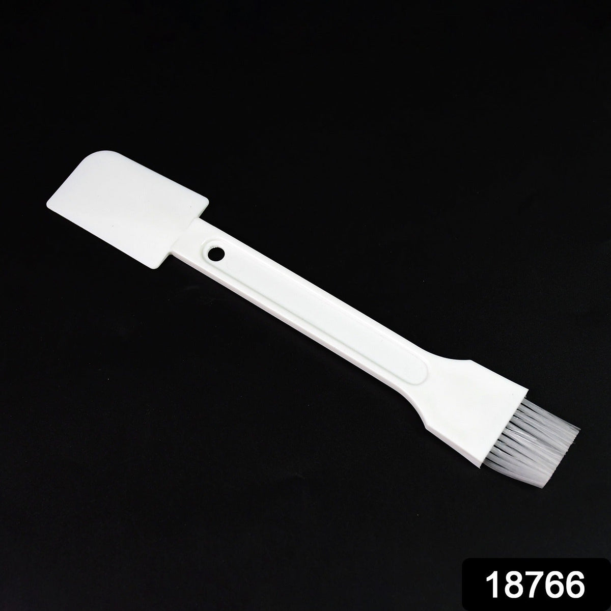 Small dust cleaning brush effectively cleaning keyboard keys.