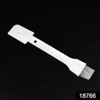 Small dust cleaning brush effectively cleaning keyboard keys.