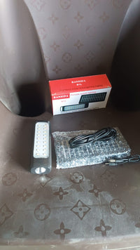 Outdoor solar light installed and glowing in garden setting at night
