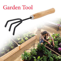 Ergonomic black handle of the steel hand cultivator, designed for comfortable use.