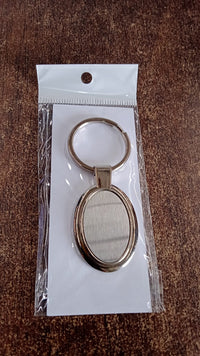 Gift-ready packaged oval metal keychain suitable for corporate gifting