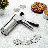 Stainless steel kitchen press with 15 interchangeable discs for making various Indian snacks.