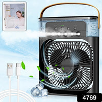 USB-powered portable fan connected to a laptop for personal cooling.