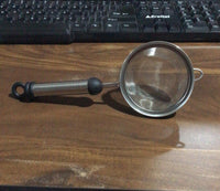 Rust-resistant stainless steel strainer with fine mesh for soups and juices.
