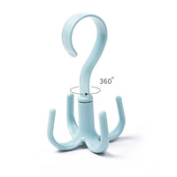 The 4-claw purse hanger hook in a wardrobe, keeping handbags organized and easily accessible.