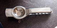 Top-down view of the high-quality stainless steel lemon squeezer.
