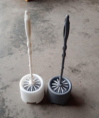 Side profile of the Pro Clean toilet cleaning brush and its compact potted holder.