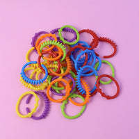 Toddler learning link rings to develop hand-eye coordination