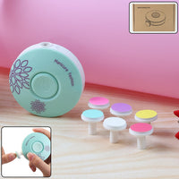 Baby electric nail trimmer with interchangeable grinding heads laid out