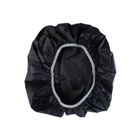 Compact rain cover shielding backpack during outdoor use