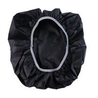 A black rain cover with a light gray elastic rim is spread open, showing its interior.